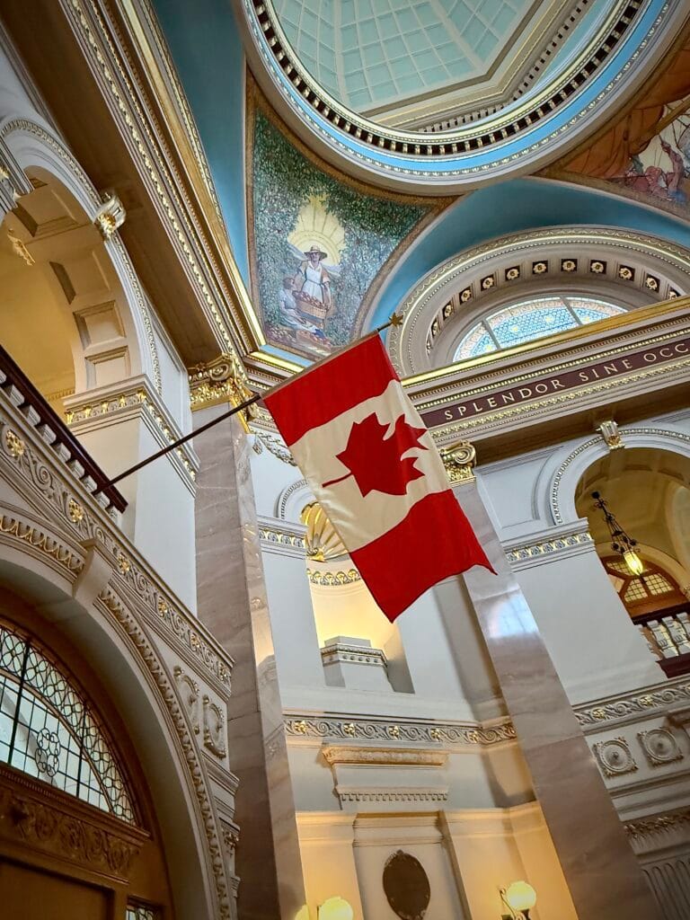 Imagine you are standing in an impressive Legislature Building and as you look up you see an extraordinary flag with a combination of red and white.