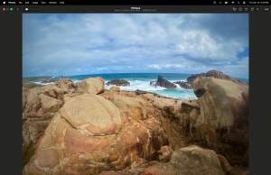 This image reflects the simple satisfaction of relaxing in an ocean park. As you stand on your rocky platform you gaze ahead and marvel on the power of the elements with restless skies and seas that open before you.