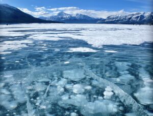 What do you call home? This photograph illustrates Abraham Lake, which is known for its frozen methane bubbles situated beneath the occasionally walkable surface.