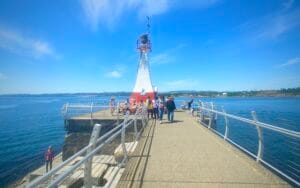This image reflects a serene and beautiful day at James Bay, Greater Vancouver. Plenty of blue skies and ocean on a calm day at James Bay are featured here.