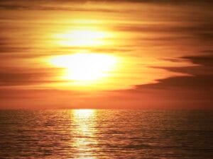 This image takes you to the Australian coastline, where a sunrise appears to ignite the sky with hues reflecting flames.