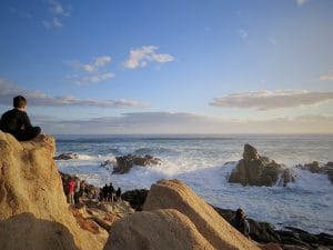 Artificial Intelligence delves into the intricacies of human consciousness, like the vastness of ocean waters, as depicted in this seascape. It is essential to be take care to ensure that suffering is not exacerbated as human and environmental qualities are not dashed against metaphorical jagged rocks.