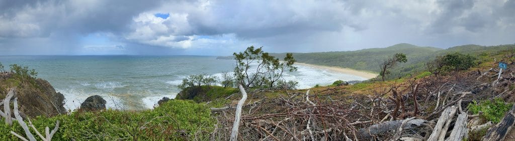 From your vista on the coastline you can see white sandy beaches, crashing surf, and there appears to be a storm brewing.